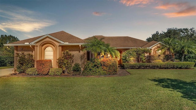 view of front of home with a yard