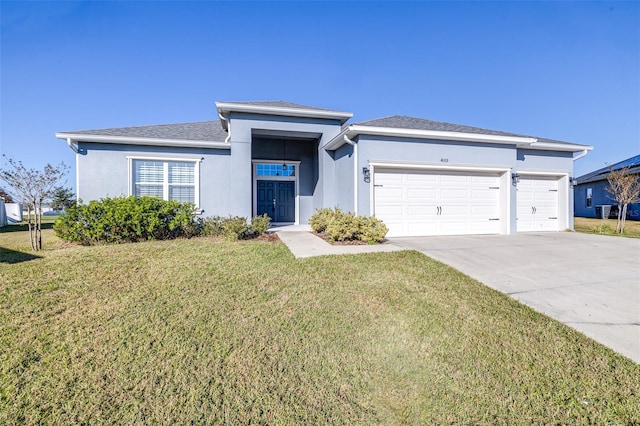 view of front of home featuring a garage and a front yard