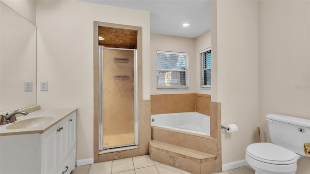 bathroom with a stall shower, a garden tub, toilet, and tile patterned floors