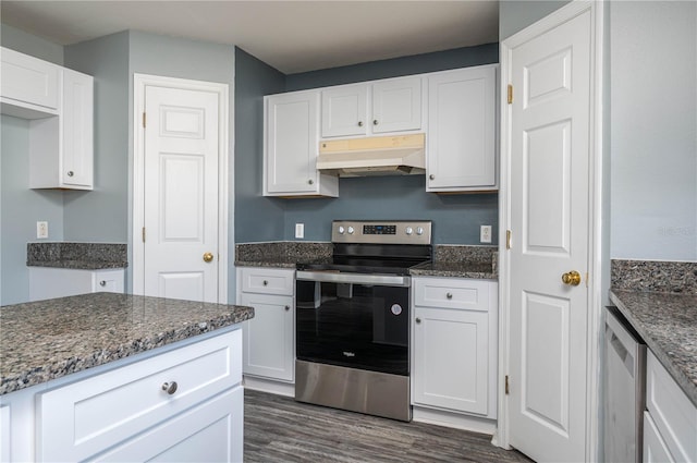 kitchen featuring appliances with stainless steel finishes, dark hardwood / wood-style flooring, white cabinetry, and dark stone countertops