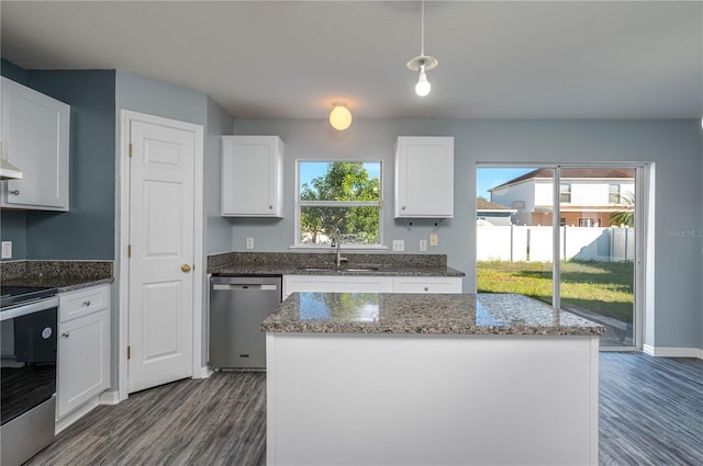 kitchen featuring a center island, white cabinetry, and appliances with stainless steel finishes