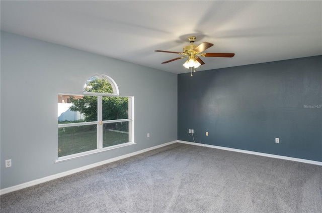 unfurnished room with carpet and ceiling fan