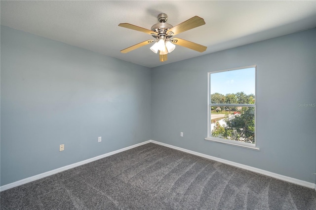 carpeted empty room with ceiling fan