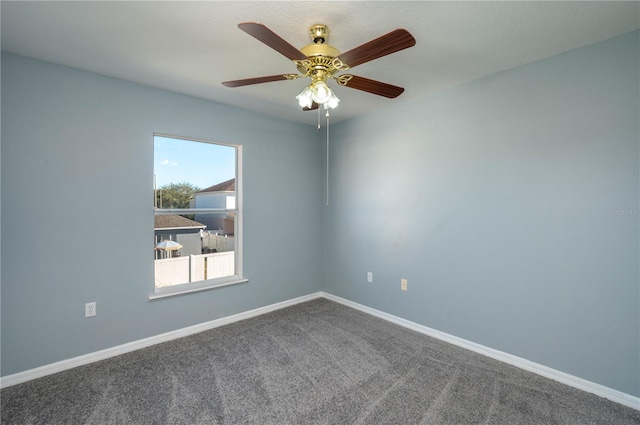 empty room with carpet and ceiling fan