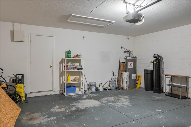 garage featuring a garage door opener and water heater