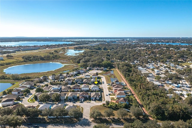 drone / aerial view with a water view