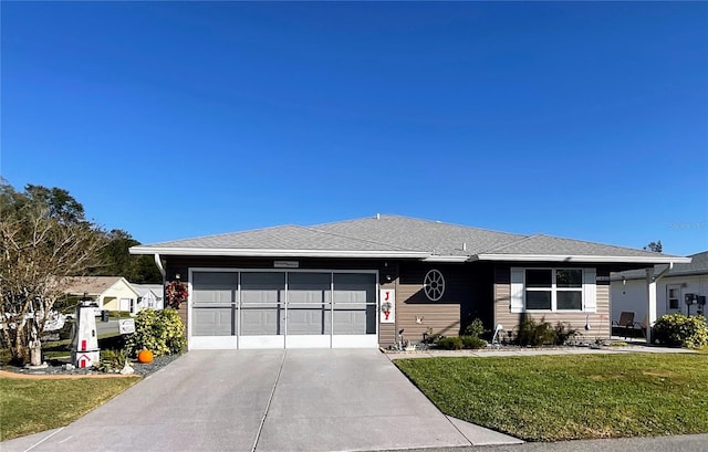 view of front of property featuring a garage and a front lawn