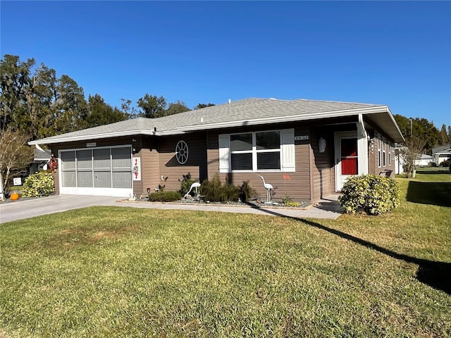 view of front of home with a garage and a front yard