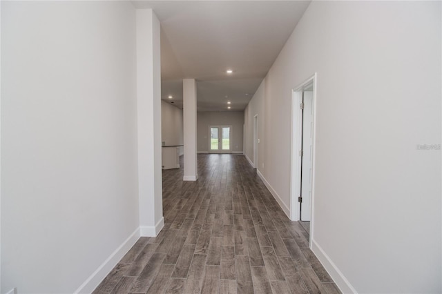 corridor with wood-type flooring