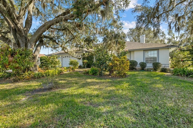 view of yard with a garage