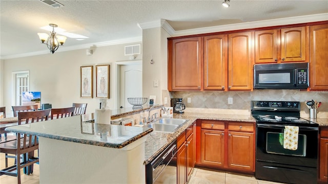 kitchen with kitchen peninsula, sink, an inviting chandelier, and black appliances