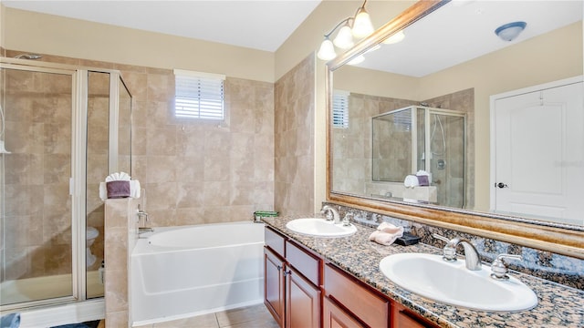 full bathroom with tile patterned flooring, vanity, toilet, and shower with separate bathtub