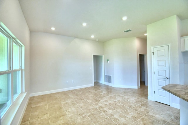 empty room with light tile patterned floors