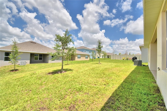 view of yard featuring central AC unit