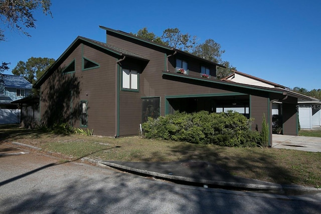 view of side of home with a carport