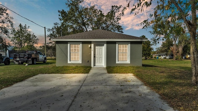 view of front of house with a lawn