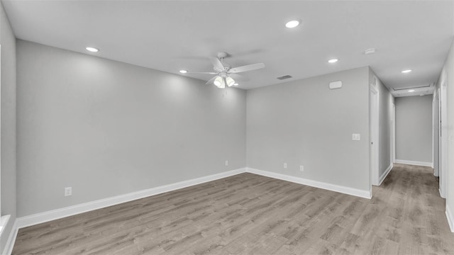 unfurnished room featuring light hardwood / wood-style floors and ceiling fan