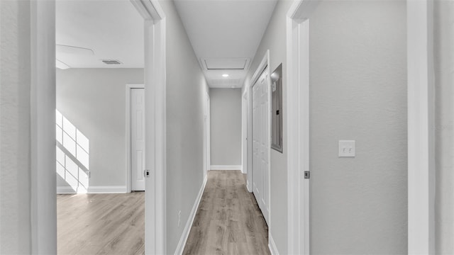 hall with light hardwood / wood-style flooring