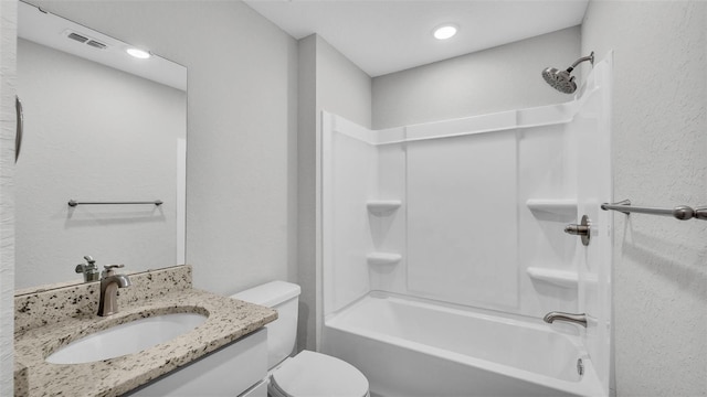 full bathroom with shower / tub combination, vanity, and toilet