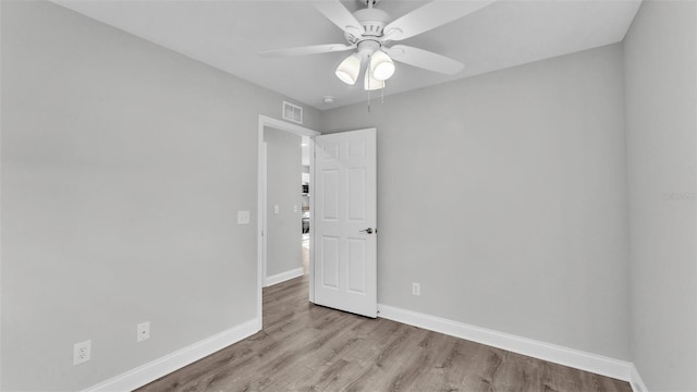 spare room with ceiling fan and light hardwood / wood-style floors