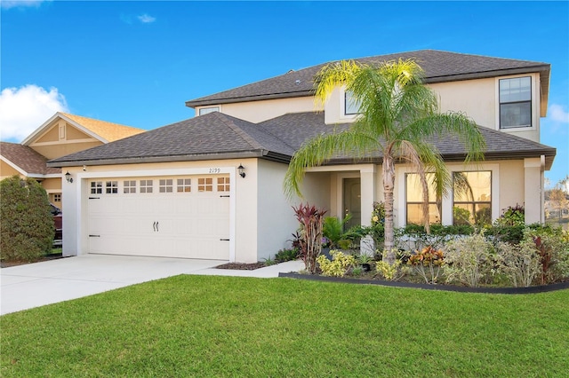 view of front of home featuring a garage and a front yard