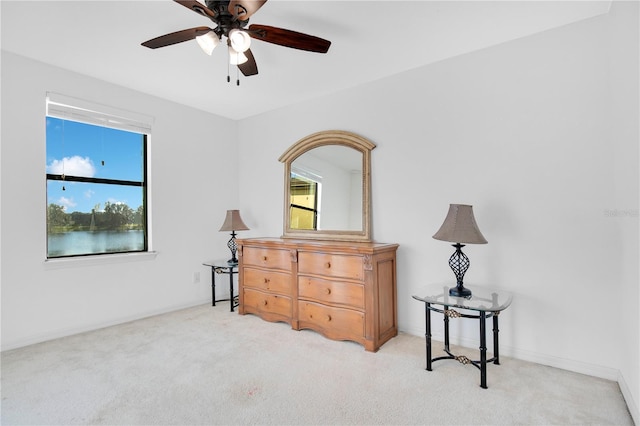 bedroom featuring ceiling fan and light carpet