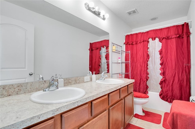 full bathroom featuring shower / bath combo, vanity, tile patterned floors, toilet, and a textured ceiling