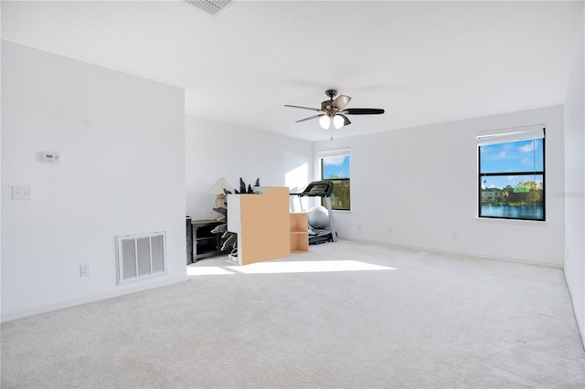 interior space with a wealth of natural light and ceiling fan