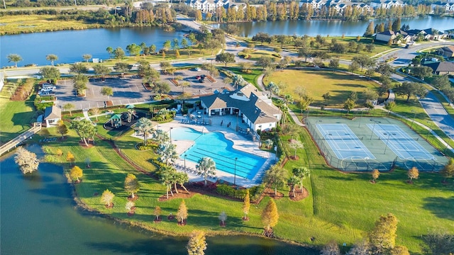 birds eye view of property with a water view