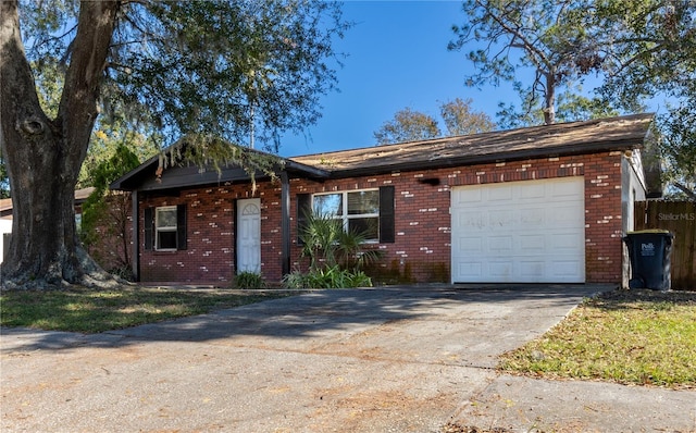 ranch-style home featuring a garage