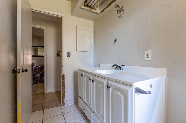 bathroom with tile patterned flooring and vanity