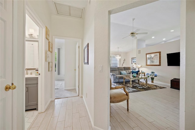 hallway featuring lofted ceiling