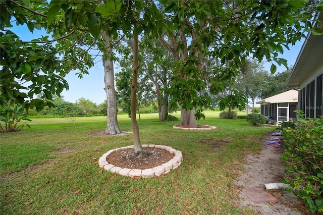 view of yard featuring a sunroom