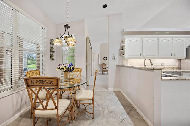 dining room with sink and light tile patterned floors