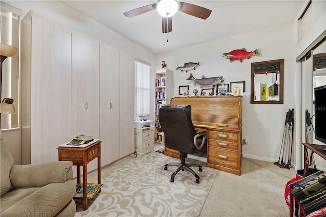 carpeted home office with ceiling fan