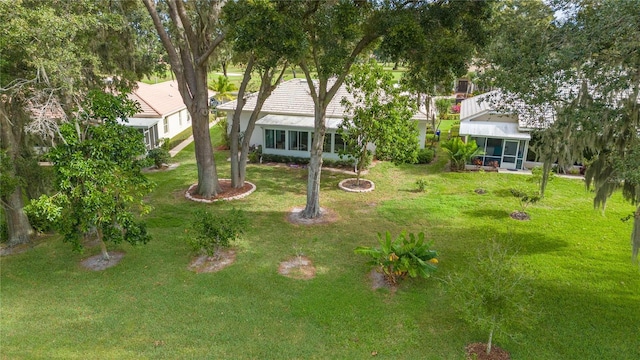 view of yard with a sunroom