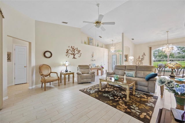 living room featuring ceiling fan with notable chandelier, light hardwood / wood-style flooring, and high vaulted ceiling
