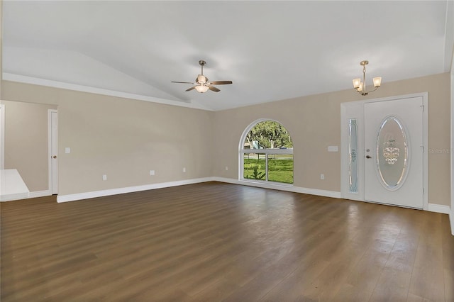 foyer featuring ceiling fan with notable chandelier, dark wood-type flooring, and vaulted ceiling