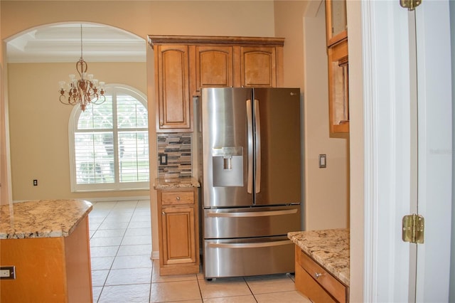 kitchen featuring backsplash, stainless steel fridge with ice dispenser, light tile patterned flooring, and an inviting chandelier