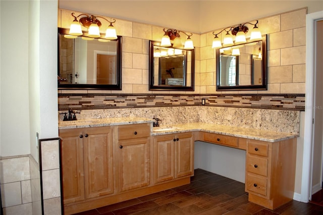 bathroom with decorative backsplash, vanity, and hardwood / wood-style flooring