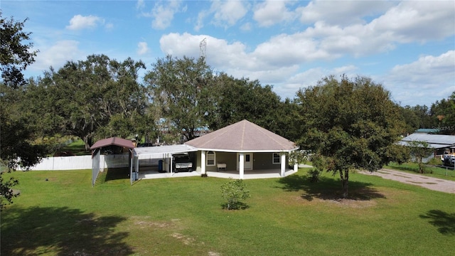 view of front of property featuring a patio area and a front lawn