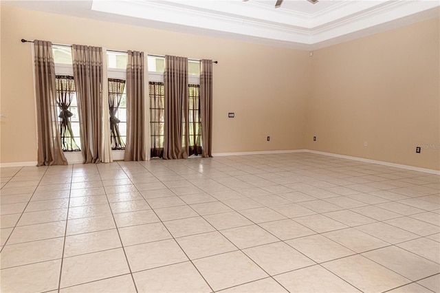 2638 E Knights Griffin Rd, Plant City, FL 33565 - spare room featuring a raised ceiling, ornamental molding, light tile patterned flooring, and baseboards