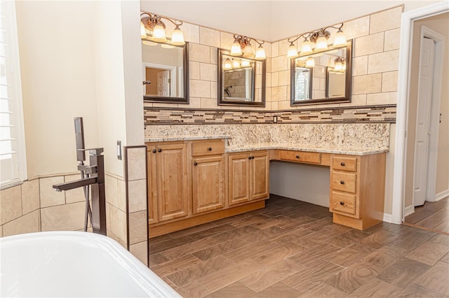 2638 E Knights Griffin Rd, Plant City, FL 33565 - full bathroom with a bath, backsplash, wood finished floors, and vanity