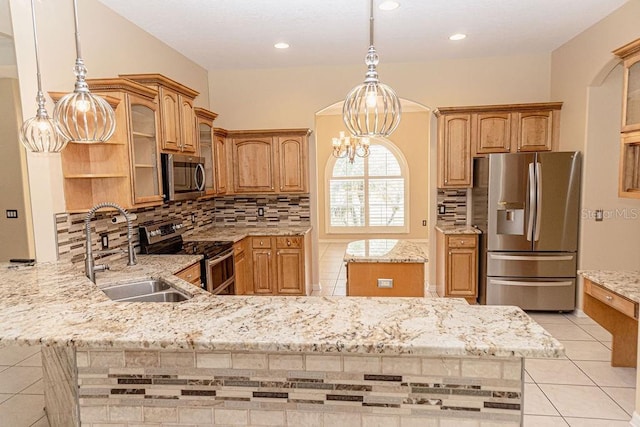 2638 E Knights Griffin Rd, Plant City, FL 33565 - kitchen with appliances with stainless steel finishes, a peninsula, a sink, backsplash, and light stone countertops