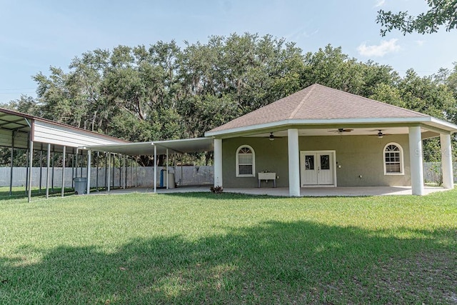 2638 E Knights Griffin Rd, Plant City, FL 33565 - back of house featuring ceiling fan, roof with shingles, a patio area, and stucco siding