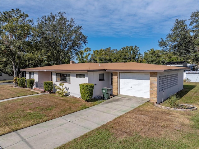 single story home with a front yard and a garage