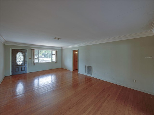 interior space featuring light hardwood / wood-style floors and ornamental molding