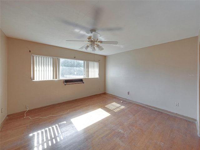 unfurnished room featuring ceiling fan and light hardwood / wood-style floors