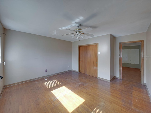 unfurnished room featuring ceiling fan and light hardwood / wood-style flooring