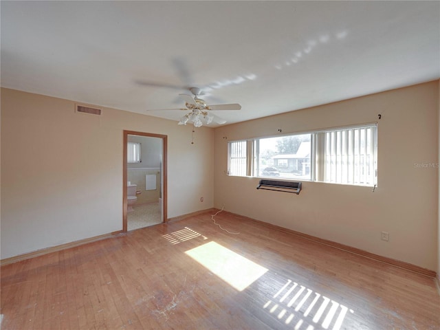 unfurnished room featuring light hardwood / wood-style flooring and ceiling fan